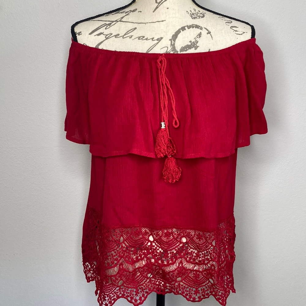 Red off the shoulder top with tassel and lace detail